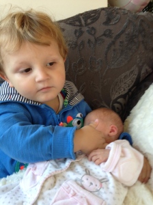 Protective over baby Molly. How I wish I could make you a big brother. 